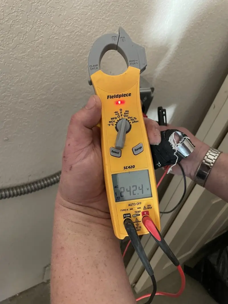 Voltage testing with clamp meter during Ceiling Fan Installation in Millville